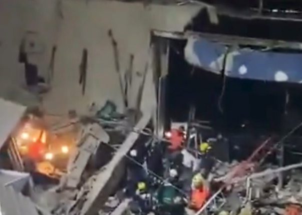 Rescue workers at the scene of a nightclub ceiling collapse.