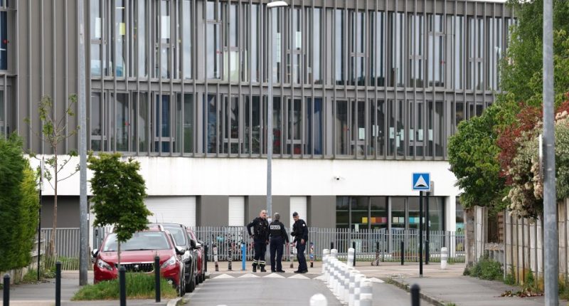 Police officers outside a school in Nantes, France.
