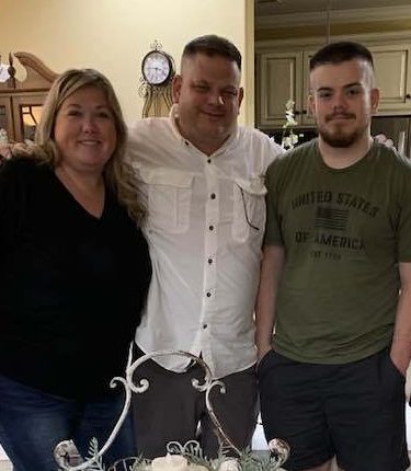 Family portrait of a mother, father, and son.