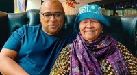 Photo of a son and mother sitting together.