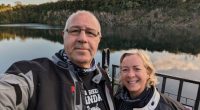 Selfie of Elaine and Graeme Winn at a lake.