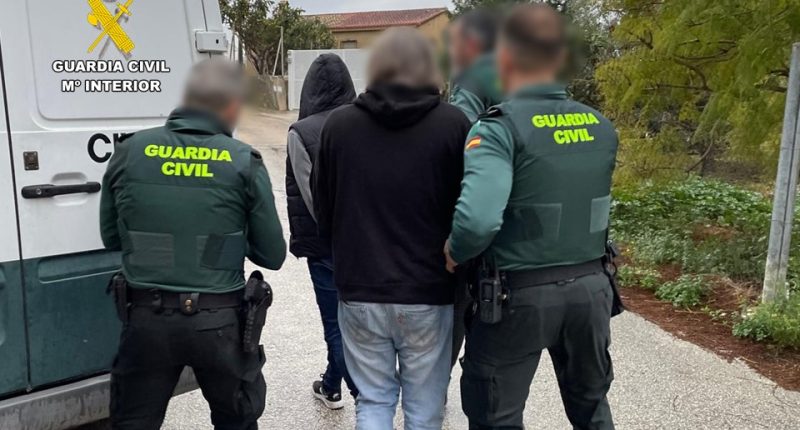 Guardia Civil officers arresting suspects.