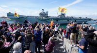 HMS Prince of Wales aircraft carrier departing Portsmouth Naval Base.