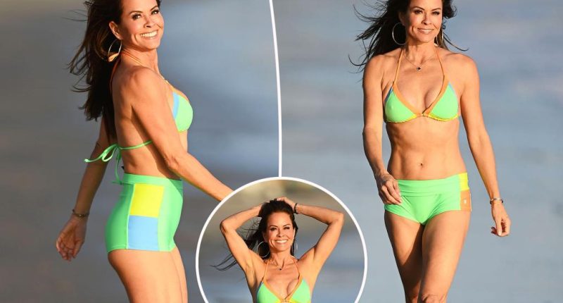 Brooke Burke, 53, flaunts toned abs in neon bikini