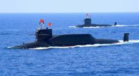FILE PHOTO: A nuclear-powered Type 094A Jin-class ballistic missile submarine of the Chinese People's Liberation Army (PLA) Navy is seen during a military display in the South China Sea April 12, 2018. Picture taken April 12, 2018. REUTERS/Stringer ATTENTION EDITORS - THIS IMAGE WAS PROVIDED BY A THIRD PARTY. CHINA OUT./File Photo