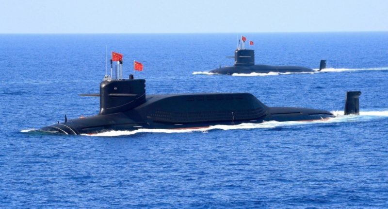 FILE PHOTO: A nuclear-powered Type 094A Jin-class ballistic missile submarine of the Chinese People's Liberation Army (PLA) Navy is seen during a military display in the South China Sea April 12, 2018. Picture taken April 12, 2018. REUTERS/Stringer ATTENTION EDITORS - THIS IMAGE WAS PROVIDED BY A THIRD PARTY. CHINA OUT./File Photo