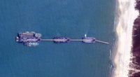 Satellite image of three Chinese barges connected by bridges off the coast of Zhanjiang, China.