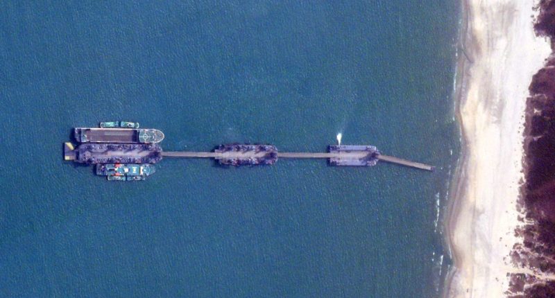 Satellite image of three Chinese barges connected by bridges off the coast of Zhanjiang, China.