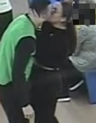 Two prisoners kissing in a prison.