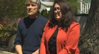 Couple sitting outside discussing a $400,000 home repair bill.