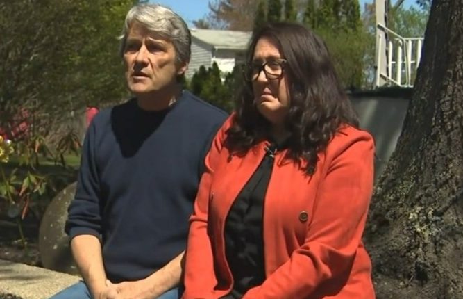Couple sitting outside discussing a $400,000 home repair bill.