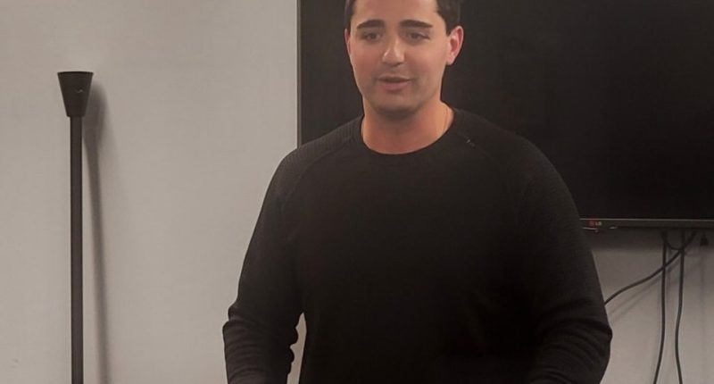 Man speaking at a podium.