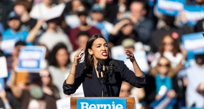 Alexandria Ocasio-Cortez speaking at a Bernie Sanders rally.