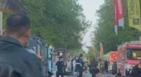 Aftermath of a vehicle driving into a crowd at a street festival.