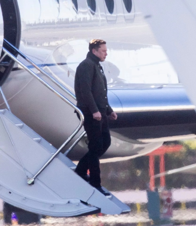 Elon Musk disembarking a private jet.