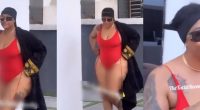 Fans reacts as Angela Okorie is seen covering her backside in raunchy swimsuit -