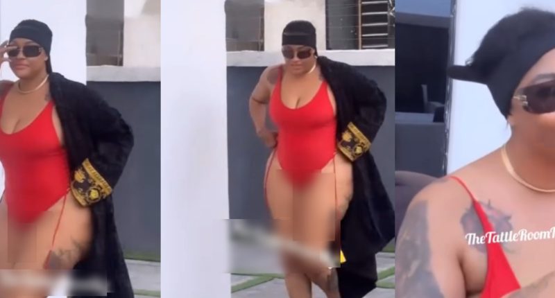Fans reacts as Angela Okorie is seen covering her backside in raunchy swimsuit -