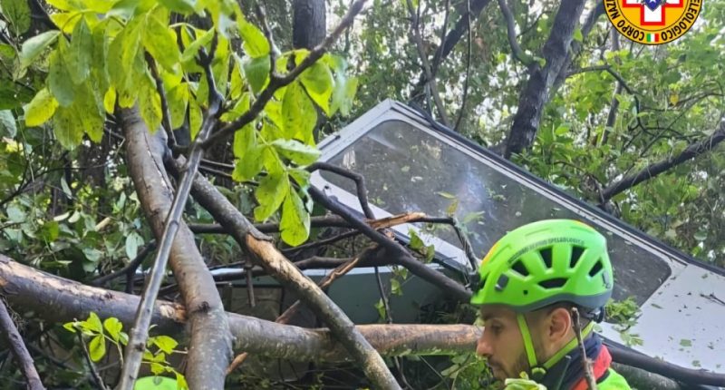 Rescuers at the site of a cable car crash.