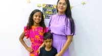 Photo of a mother and her two children.