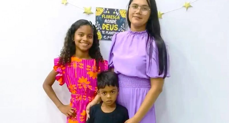 Photo of a mother and her two children.
