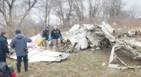 Investigators examining the wreckage of a plane crash.
