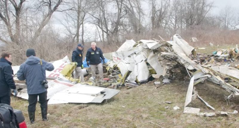 Investigators examining the wreckage of a plane crash.