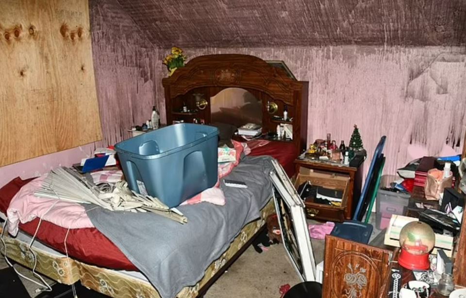 Messy bedroom with a bed, dresser, and various items strewn about.
