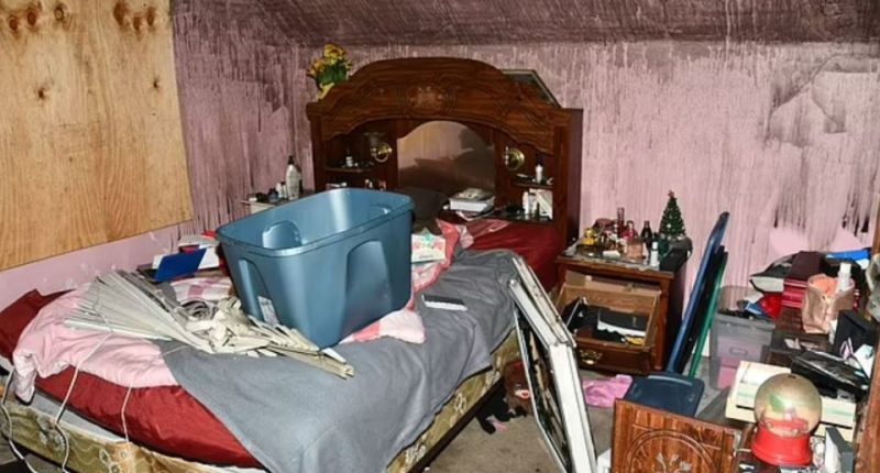Messy bedroom with a bed, dresser, and various items strewn about.