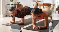 couple demonstrating getting a fitter body after 40 with virtual fitness class