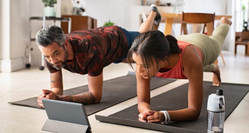couple demonstrating getting a fitter body after 40 with virtual fitness class