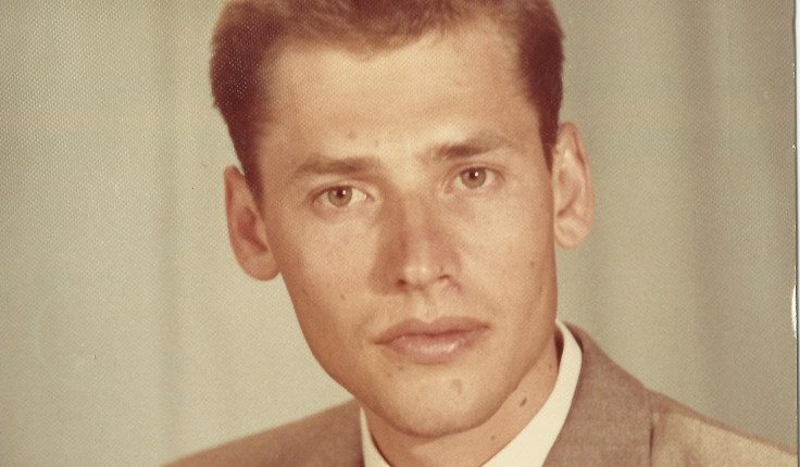 Portrait of a young man in a suit.