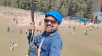 Insane moment tourist obliviously ziplines above fatal terror attack