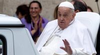 Pope Francis waving to the faithful.