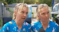 Twin sisters in matching blue shirts being interviewed.