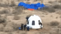 Jeff Bezos falls after Blue Origin New Shepard capsule lands