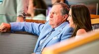Jordon Hudson ribs Bill Belichick's clothing at NHL playoff game