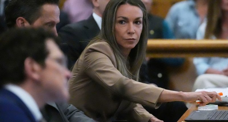 Karen Read with her defense team during her trial.