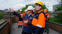 Government officials touring a British Steel plant.