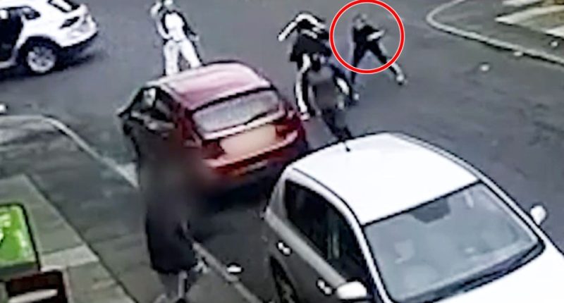 Surveillance footage of a street fight.
