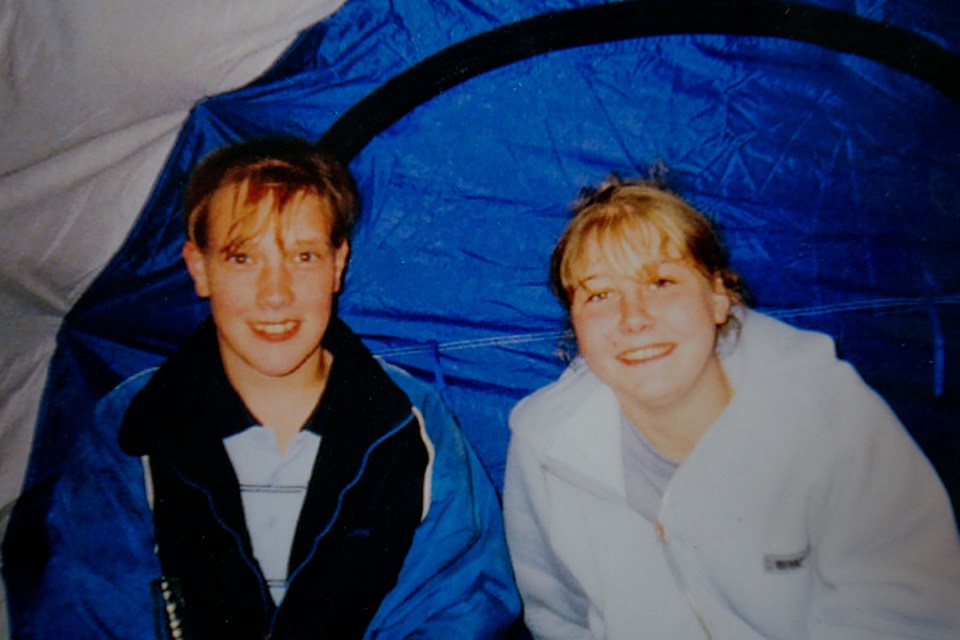 Photo of two teenagers in a tent.