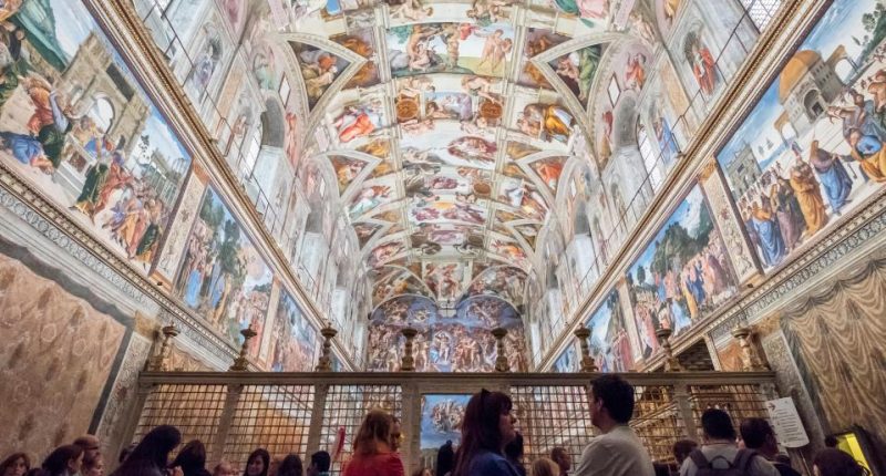 Tourists viewing Michelangelo's Sistine Chapel ceiling.
