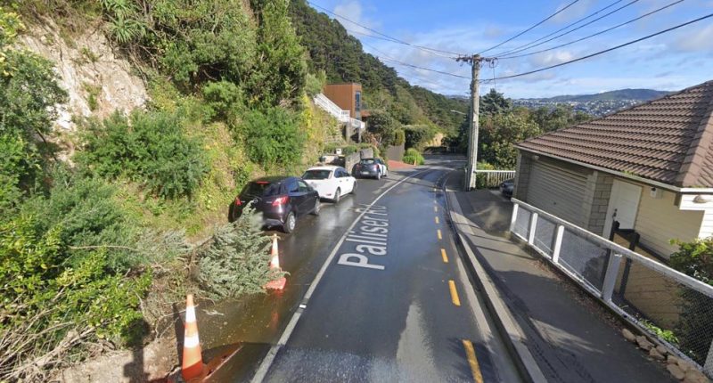 Palliser Rd, Roseneath, Wellington, New Zealand: street scene with parked cars and a small landslide.