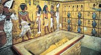 Tutankhamun's tomb with sarcophagus and wall paintings.