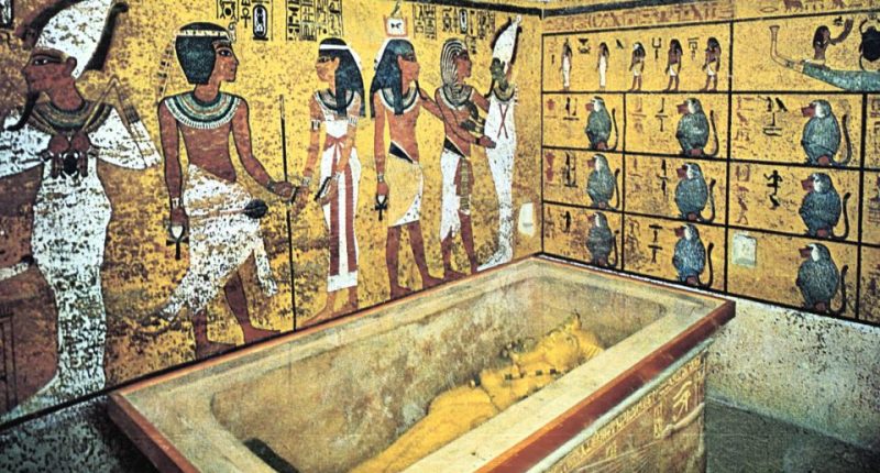 Tutankhamun's tomb with sarcophagus and wall paintings.