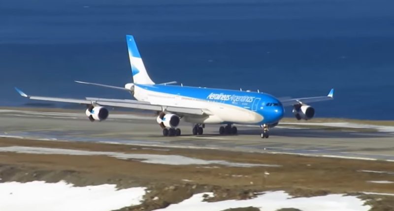 Aerolineas Argentinas airplane taxiing on a runway.