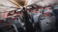 Blurred photo of airplane interior during turbulence.