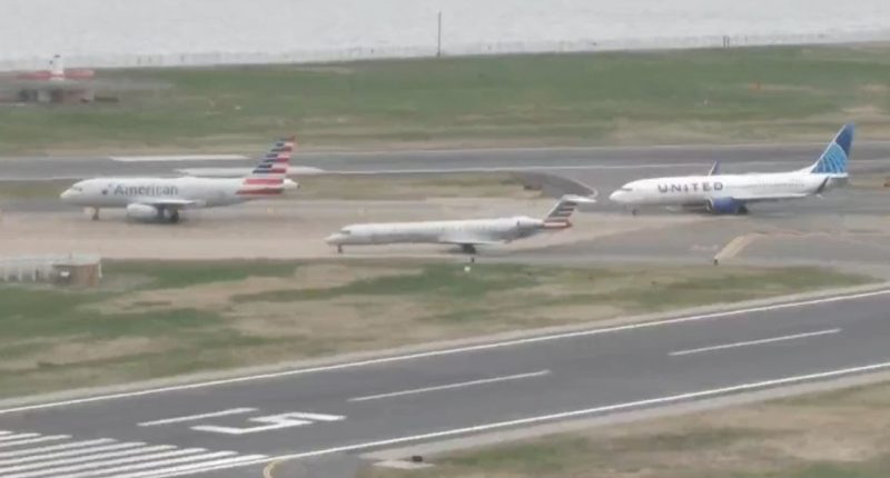 Three airplanes on an airport tarmac; one American Airlines plane, one United Airlines plane, and one American Airlines regional jet.
