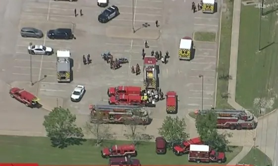 Aerial view of police and emergency vehicles at Wilmer-Hutchins High School.