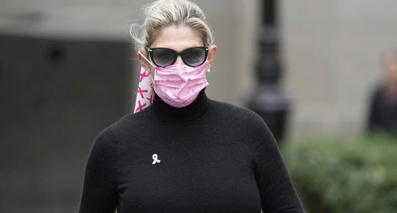 Politician's wife hides face as she's found GUILTY of bribery scheme