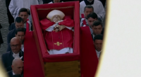 Pallbearers carrying the Pope's coffin.